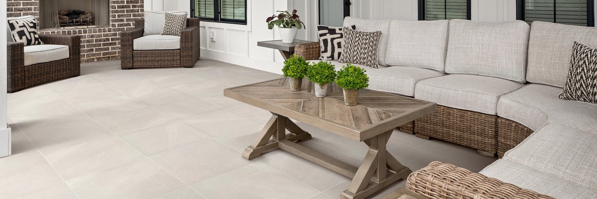 big white couch with brown coffee table on white tile floor from Anderson Flooring Centre, Inc. in Winnipeg, MB