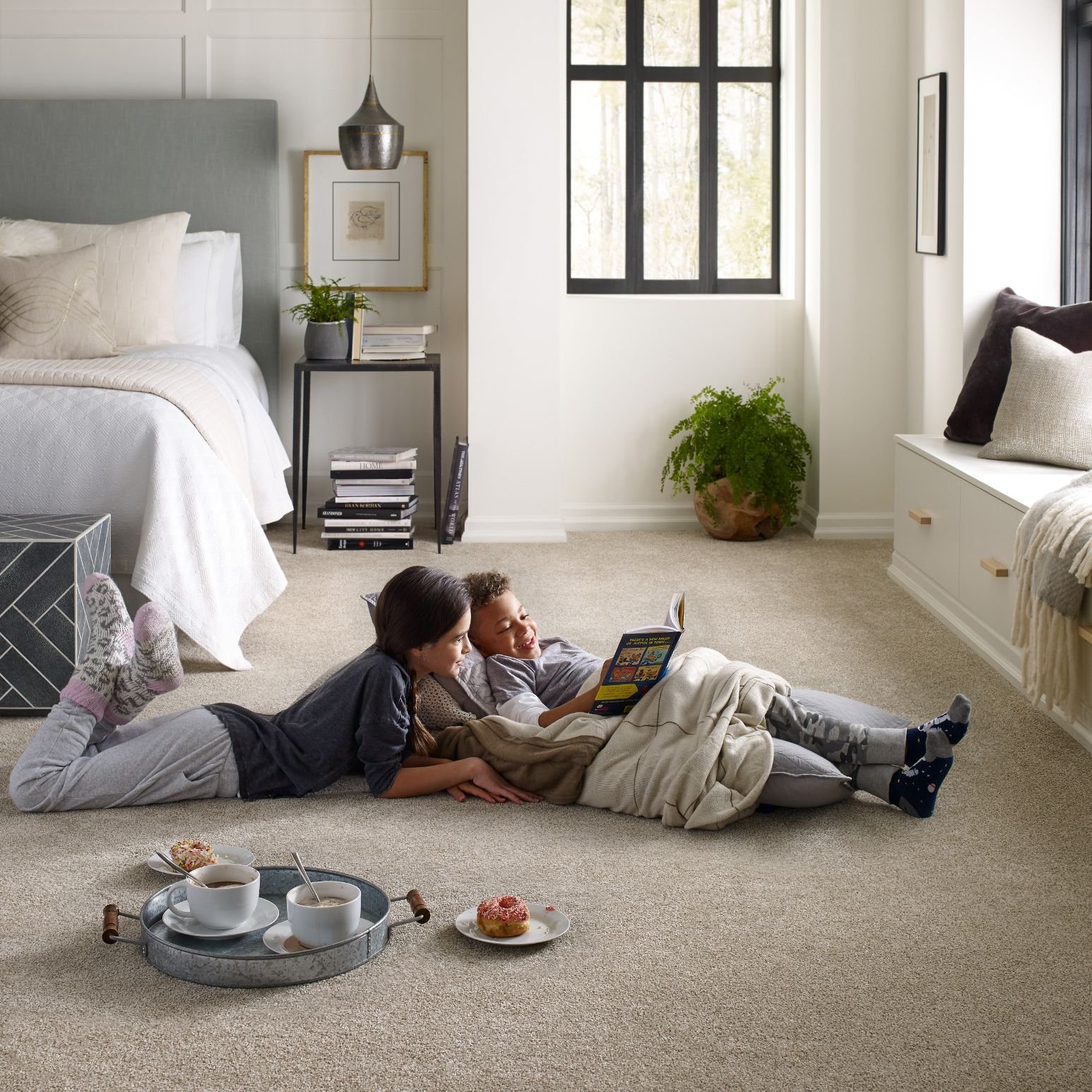 kids reading on soft beige carpet from Anderson Flooring Centre, Inc. in Winnipeg, MB