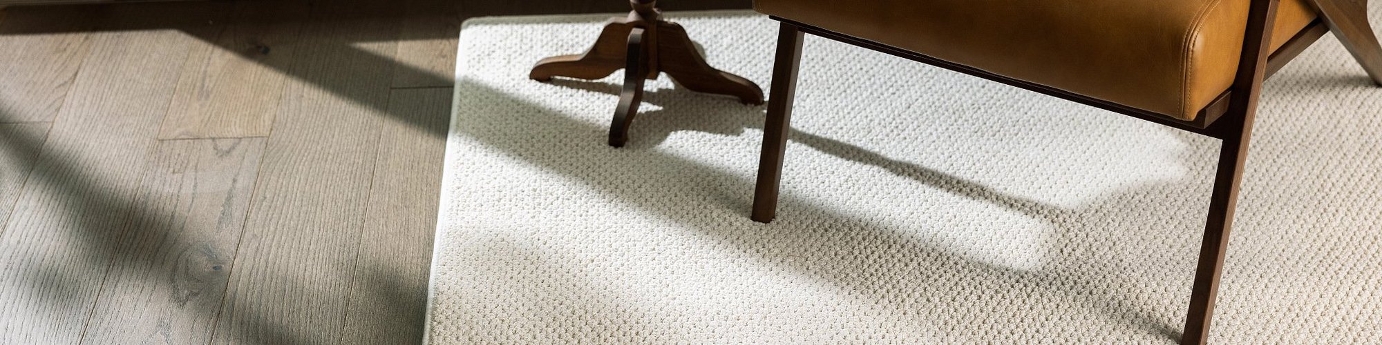 brown chair on white rug from Anderson Flooring Centre, Inc. in Winnipeg, MB